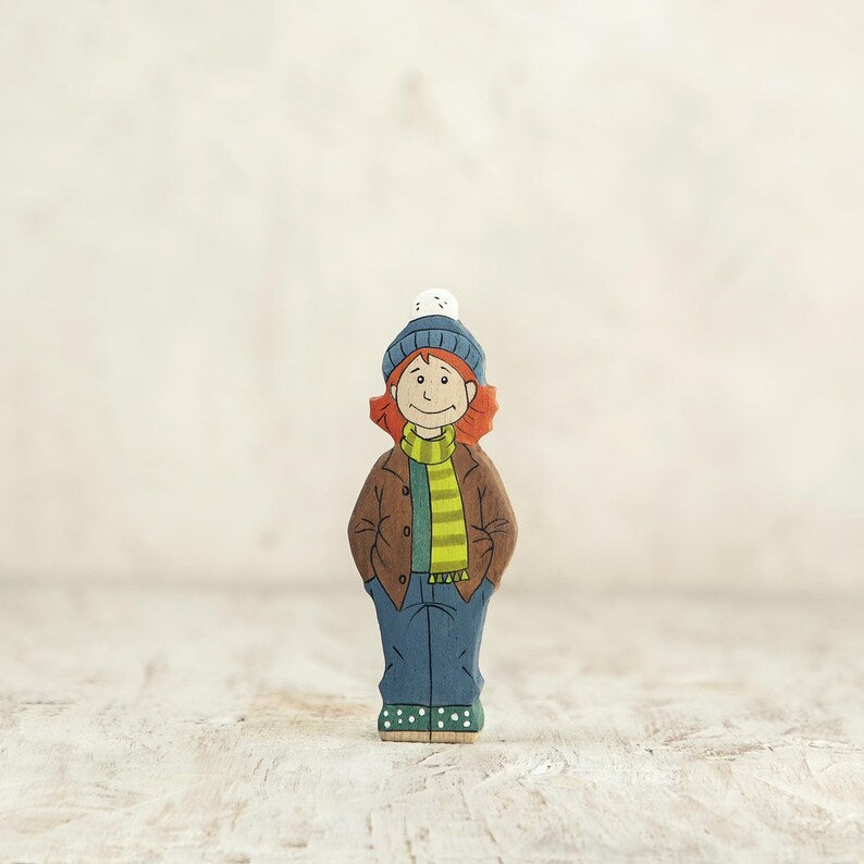 Wooden Girl Figurine in Brown Coat – Handcrafted Winter Toy for Kids