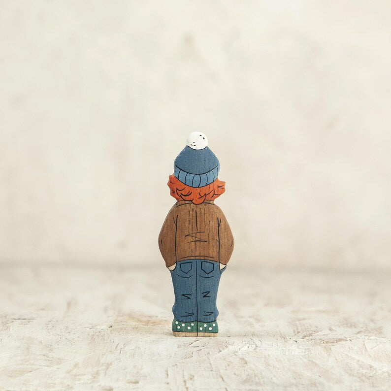 Wooden Girl Figurine in Brown Coat – Handcrafted Winter Toy for Kids